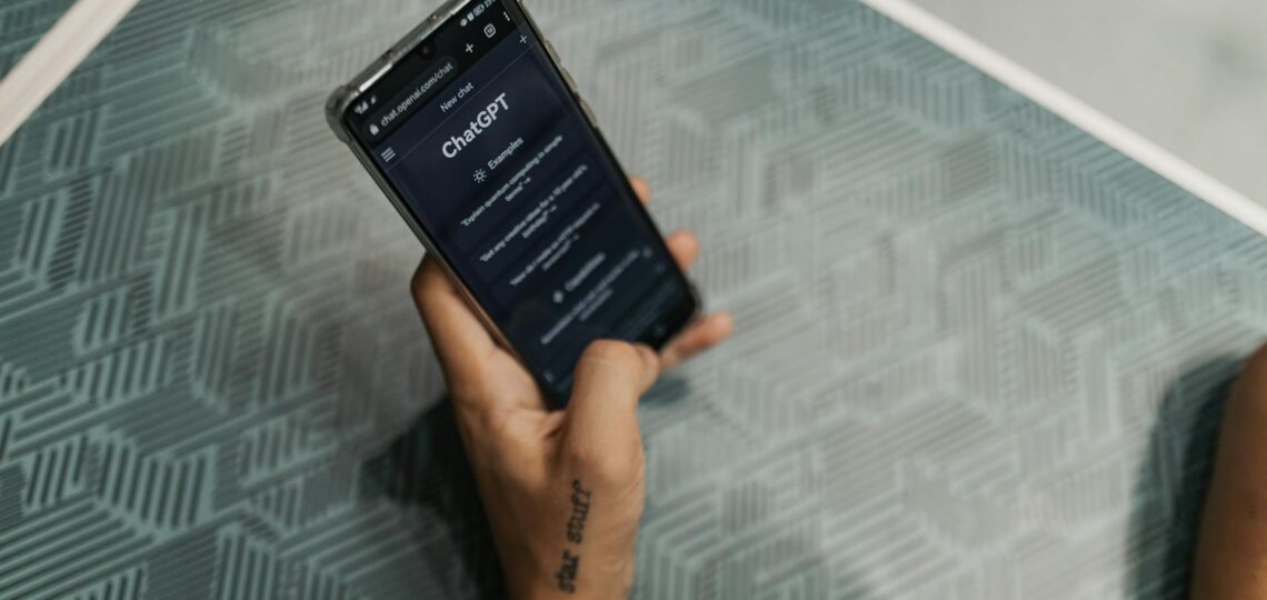 Close-up of ChatGPT interface on a dark screen highlighting chat functionality.