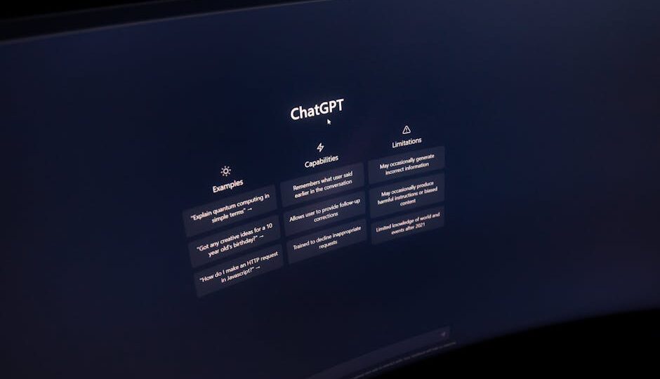 Close-up of a computer screen displaying ChatGPT interface in a dark setting.