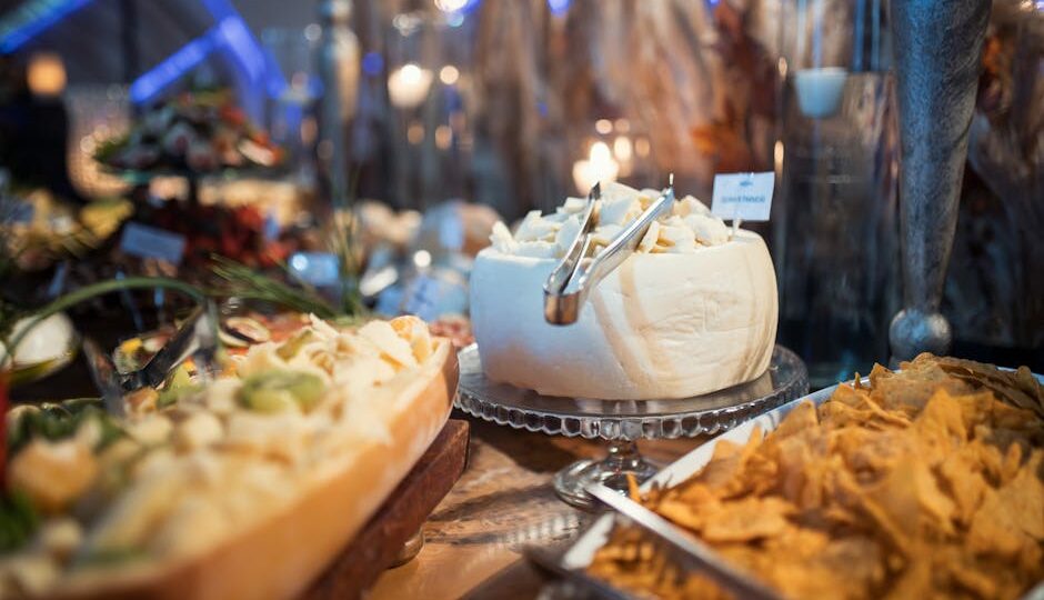 A close-up of an exquisite cheese platter at a sophisticated event, perfect for culinary enthusiasts.