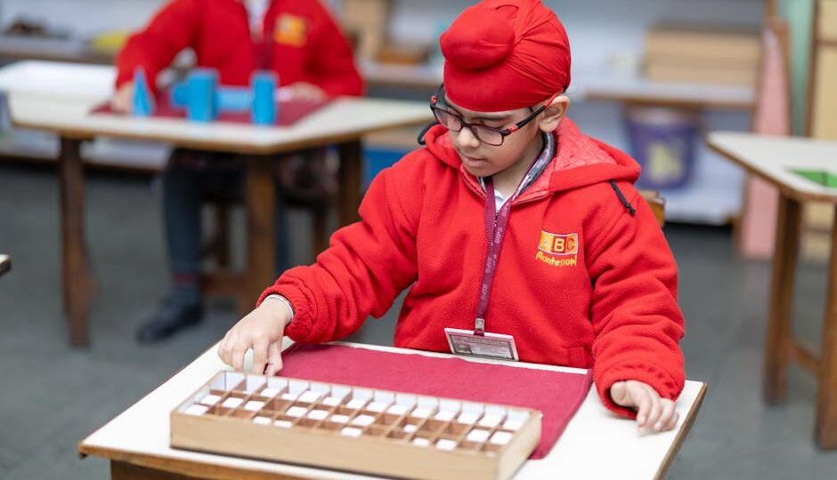 A child focused on educational activity in a Montessori classroom. Bright learning environment.