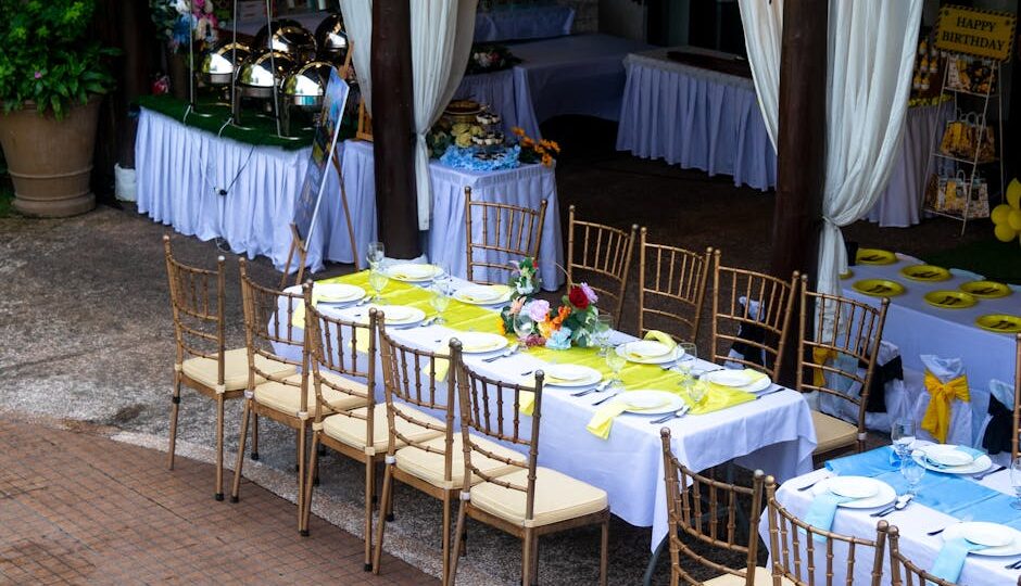 A beautifully arranged outdoor dining setting for a birthday party with vibrant decor and table arrangements.