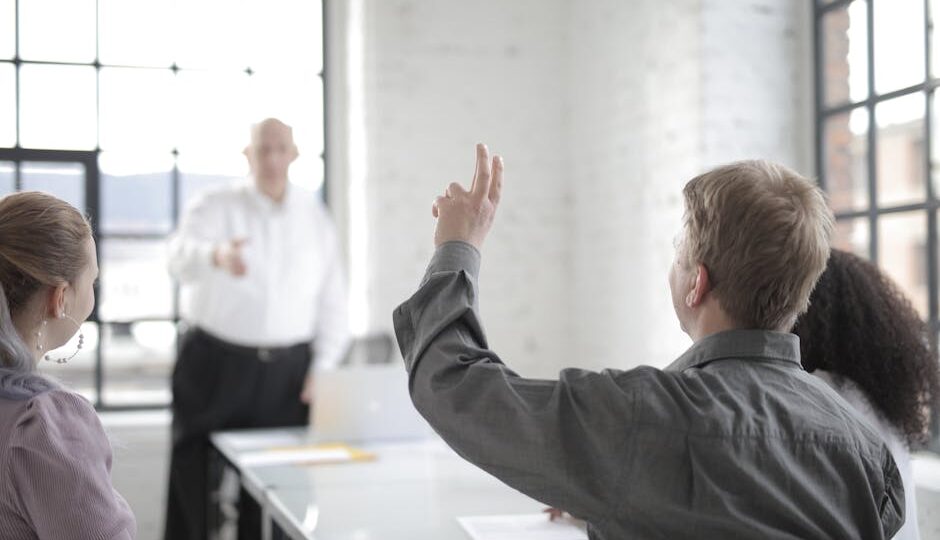 Colleagues engaged in a brainstorming session in a modern office setting.