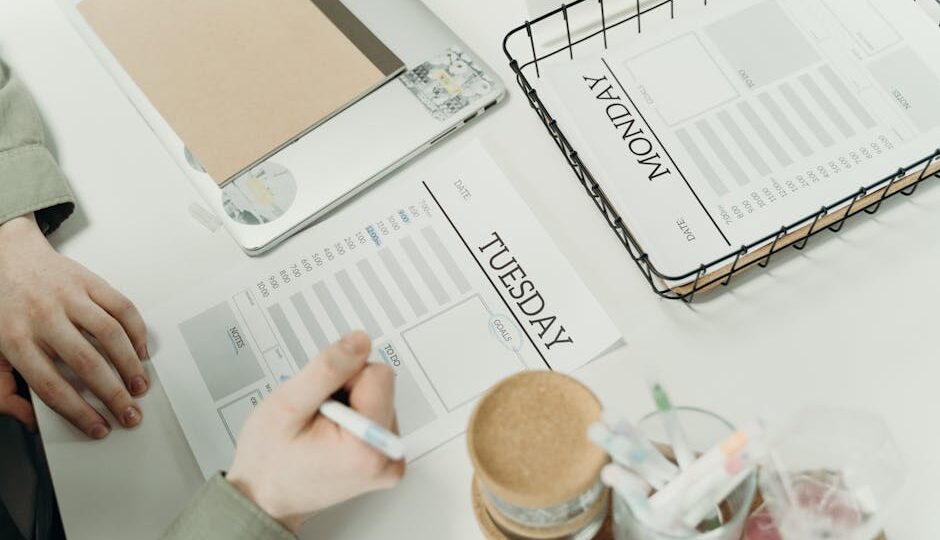 A professional organizing the week with detailed schedule planners in an office setting.