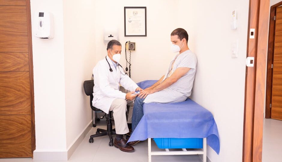 Doctor checking patient's vitals in a clinical setting for health consultation.